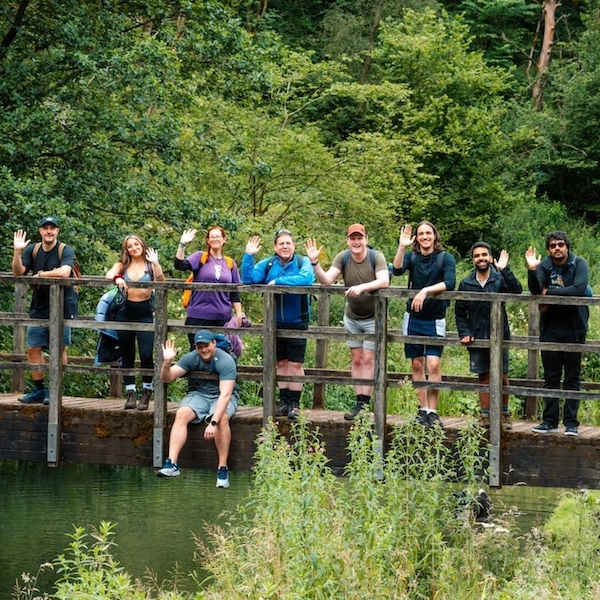 Team members on a bridge in countryside